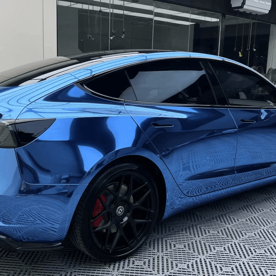 blue mirror chrome vinyl car wrapped in tesla